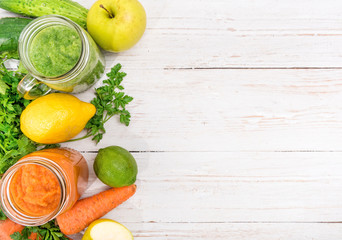 Vegetable smoothies  in glass jars on a wooden background. Concept of cooking.
