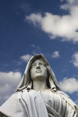 Statue of a classical female looking at the sky