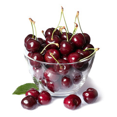 Cherries in bowl close up isolated on white background.