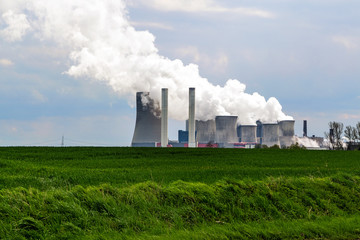 Fototapeta na wymiar lignite fired power station behind a agricultural landscape
