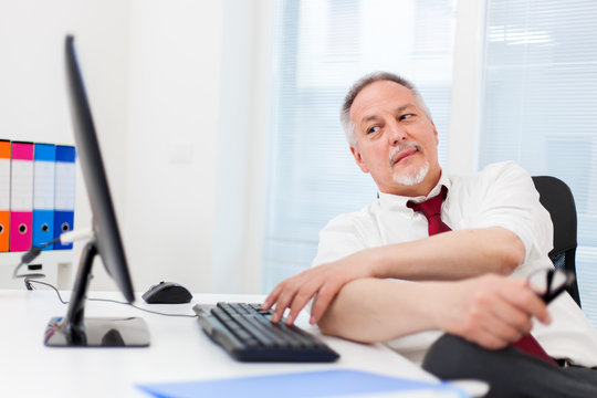 Senior businessman working with his computer