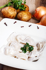 Dumplings with potatoes garnished with Sour Cream and Butter