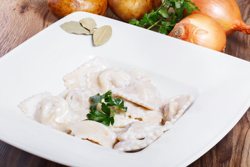 Dumplings with potatoes garnished with Sour Cream and Butter