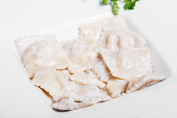 Dumplings with potatoes garnished with Sour Cream and Butter