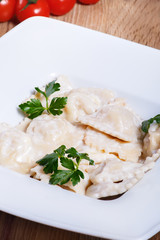 Dumplings with potatoes garnished with Sour Cream and Butter