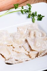 Dumplings with potatoes garnished with Sour Cream and Butter