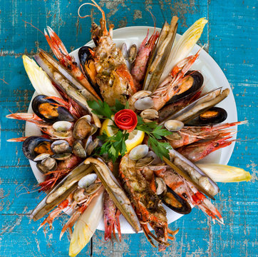 seafood dish on blue wooden table