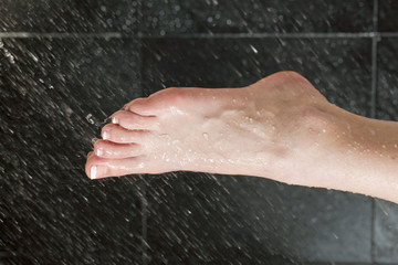 female washing her foot