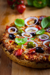 Traditional homemade pizza with tomatoes and olives