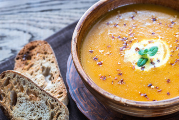 Bowl of spicy pumpkin cream soup: top view