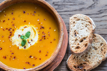 Bowl of spicy pumpkin cream soup: top view
