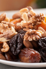 Dried fruits mix with nuts, closeup macro shot, selective focus