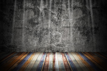 light in dark room with colorful wooden floor and grunge stone wall