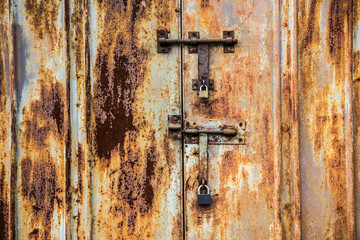 Rusty locked garage door background.