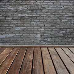 brown wood plank floor with black brick texture wall