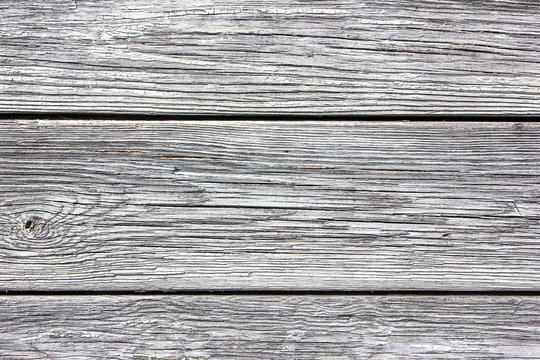Gray wooden desks peeling paint background.