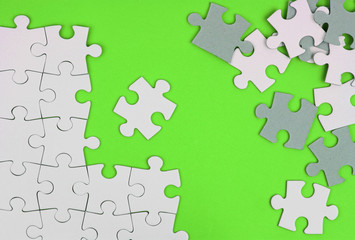 Puzzle pieces on green background