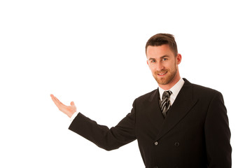 Happy young businessman in suit and tie presenting, promoting, a