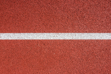 Running track with white line texture.