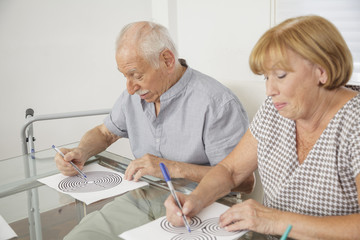 senior couple testing minds for Alzheimer