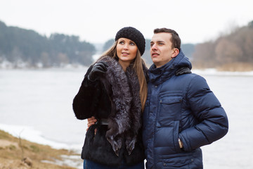 Couple playing on the coast