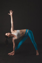 Fototapeta na wymiar Beautiful sporty yogi girl practices yoga asana
