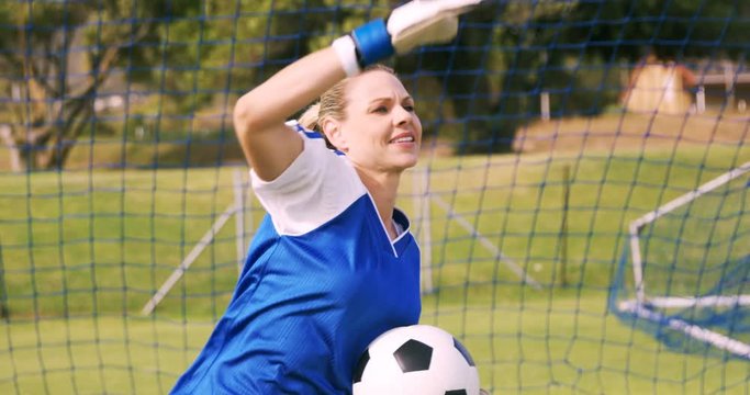 Goalkeeper in blue making gesture