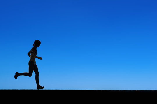 silhouette woman running on blue background