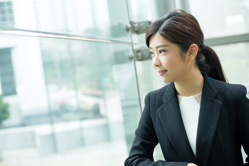 Businesswoman looking out of window