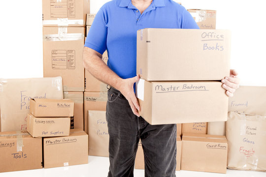 Man lifting and holding moving boxes