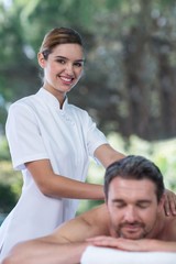 Obraz premium Man receiving back massage from masseur