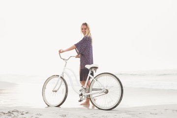 Pretty blonde woman riding her bicycle