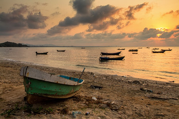 Fishing boats, small boats floating in the sea at sunrise, Conce
