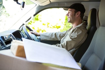 Delivery man driving his van