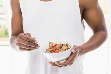 Close-up of man having breakfast cereals