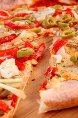 Italian vegetarian pizza on wooden surface
