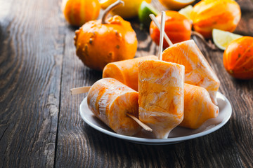Frozen dessert. Butternut squash popsicle with yoghurt