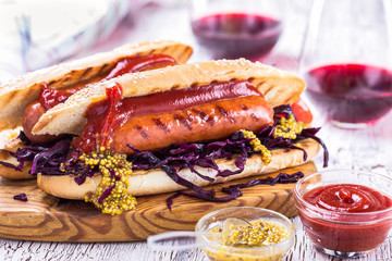 Grilled sausage sandwich with sweet coleslaw and tangy mustard