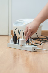 man unplugged plug to save on energy