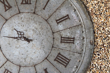 Wall clock old rusty grunge on stone wall background, (with clipping path)