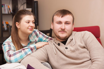 wife lovingly looks at his husband