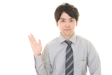 案内する笑顔のビジネスマン