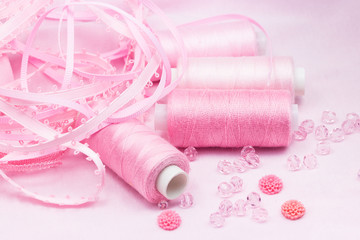 Threads, beads and ribbons. Pink