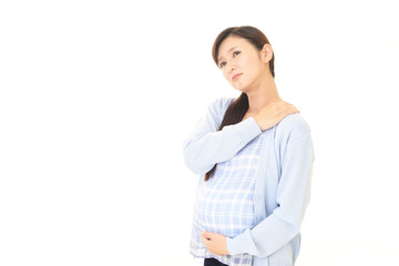 疲れた表情の妊婦
