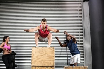 Naklejka premium Fit people exercising together