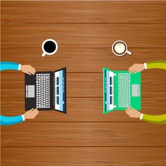 Two people working with computers