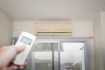 Turn off remote air conditioner when not in use,Energy saving concept.