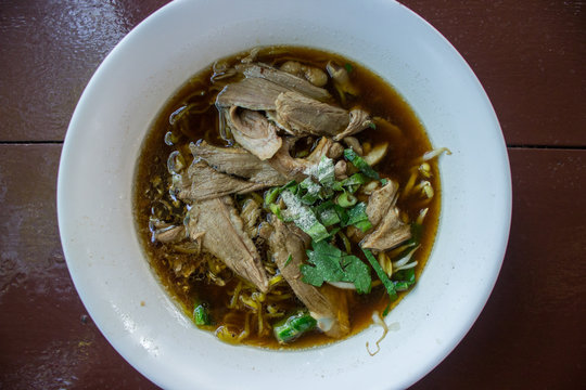duck noodle in brown soup