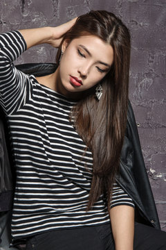 Portrait of an Asian girl wearing a striped shirt