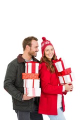 Young couple holding gifts